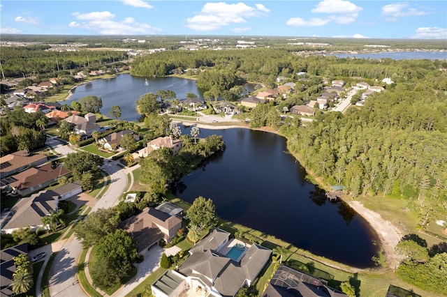 15104 Azra Dr, Odessa, FL 33556 - aerial view of property and surrounding area with a heavily wooded area, a nearby body of water, and nearby suburban area