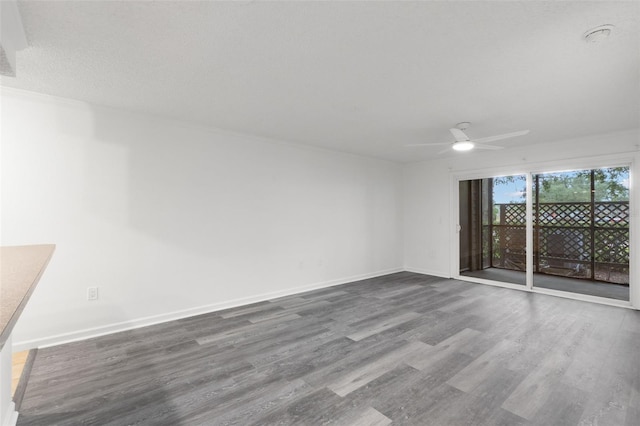2500 Winding Creek Blvd Unit A104, Clearwater, FL 33761 - spare room featuring wood finished floors, ceiling fan, and baseboards