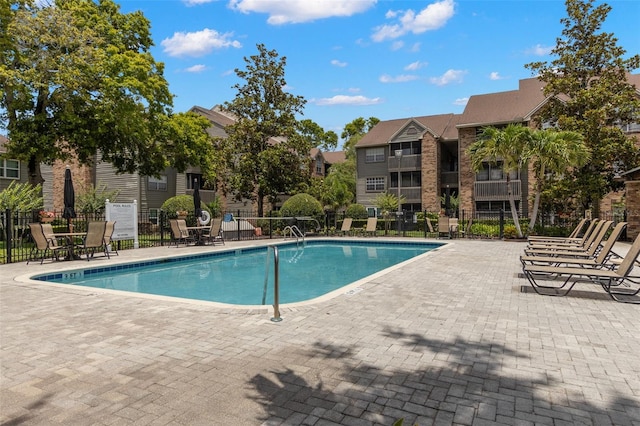 2500 Winding Creek Blvd Unit A104, Clearwater, FL 33761 - community pool with fence and a patio area