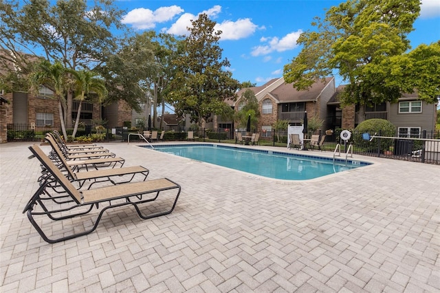 2500 Winding Creek Blvd Unit A104, Clearwater, FL 33761 - community pool with fence, a residential view, and a patio area