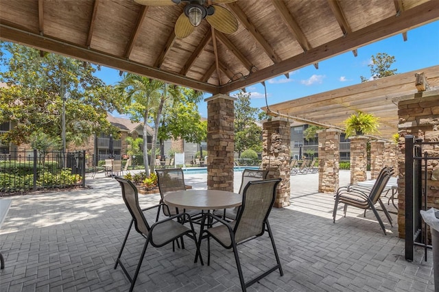 2500 Winding Creek Blvd Unit A104, Clearwater, FL 33761 - view of patio featuring ceiling fan, fence, and a community pool