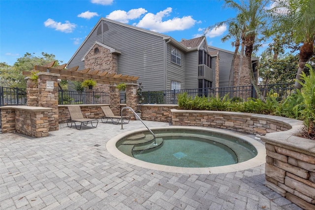 2500 Winding Creek Blvd Unit A104, Clearwater, FL 33761 - view of pool with a pergola, fence, a community hot tub, and a patio area