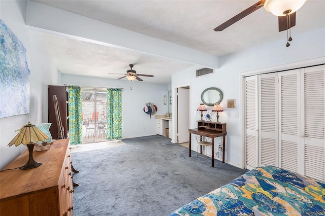 5250 12th St N, Saint Petersburg, FL 33703 - bedroom with carpet, beam ceiling, a closet, and a ceiling fan