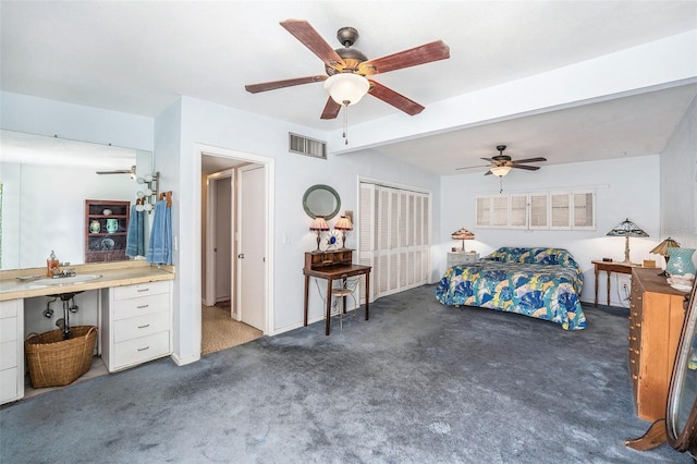 5250 12th St N, Saint Petersburg, FL 33703 - bedroom with carpet, a sink, beam ceiling, and ceiling fan