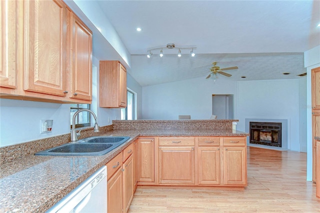 4911 Country Aire Ln, Tampa, FL 33624 - kitchen featuring light brown cabinets, a sink, a peninsula, dishwasher, and lofted ceiling