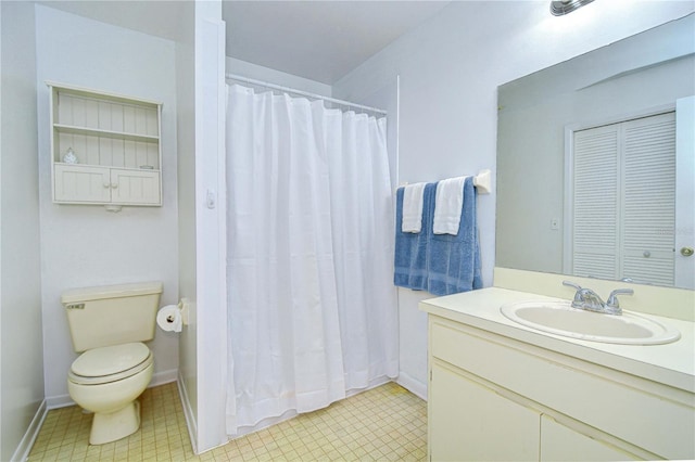 4911 Country Aire Ln, Tampa, FL 33624 - bathroom featuring toilet, vanity, and curtained shower