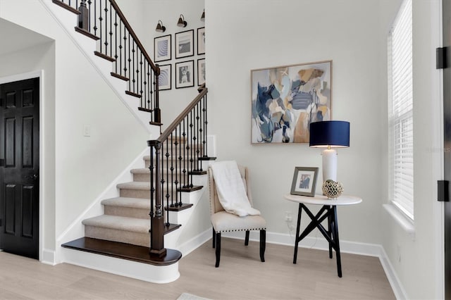 3850 Bonfire Dr, Odessa, FL 33556 - entrance foyer with wood finished floors, plenty of natural light, stairs, baseboards, and a towering ceiling