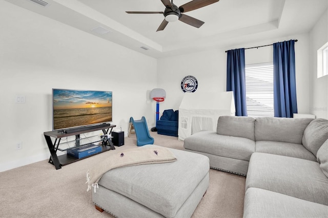 3850 Bonfire Dr, Odessa, FL 33556 - living area with ceiling fan, carpet floors, and a raised ceiling