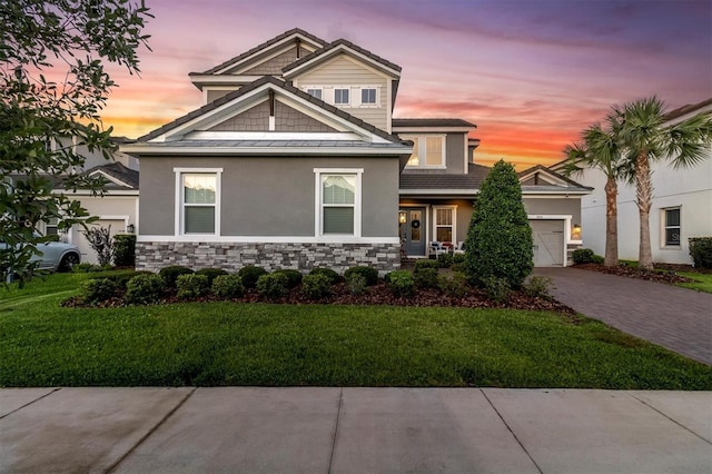 3850 Bonfire Dr, Odessa, FL 33556 - view of front of property with driveway, an attached garage, stucco siding, and a yard