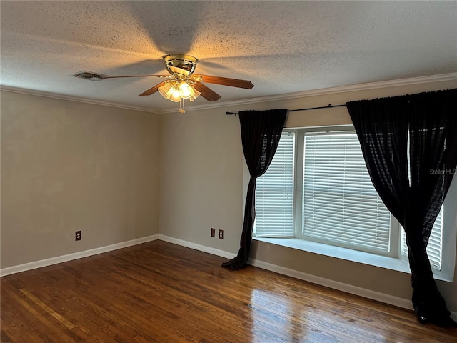 unfurnished room with ceiling fan, ornamental molding, wood finished floors, a textured ceiling, and baseboards