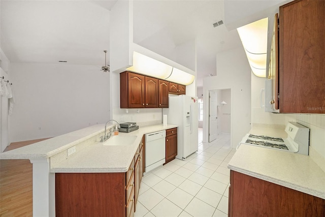 13819 Stoneridge Dr, Hudson, FL 34669 - kitchen featuring white appliances, a sink, light countertops, and tasteful backsplash