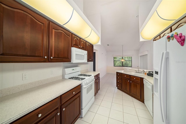 13819 Stoneridge Dr, Hudson, FL 34669 - kitchen with white appliances, light tile patterned floors, light countertops, a sink, and lofted ceiling