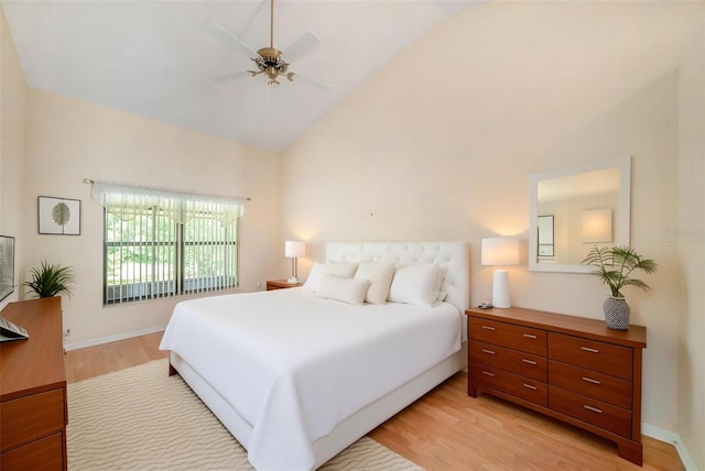13819 Stoneridge Dr, Hudson, FL 34669 - bedroom with light wood-type flooring, high vaulted ceiling, ceiling fan, and baseboards