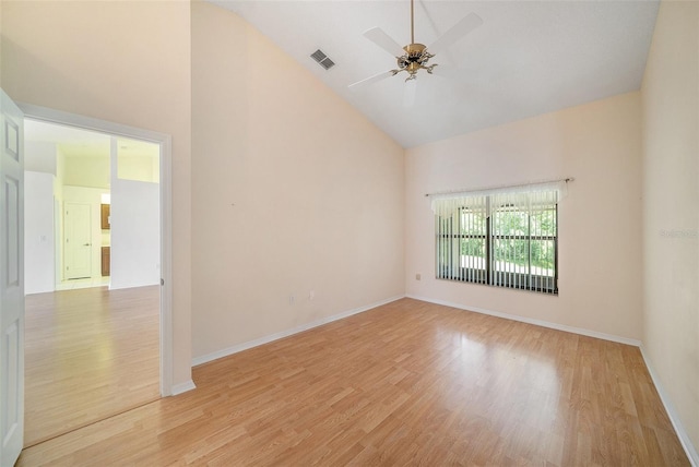 13819 Stoneridge Dr, Hudson, FL 34669 - spare room with high vaulted ceiling, a ceiling fan, wood finished floors, and baseboards