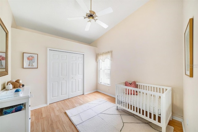 13819 Stoneridge Dr, Hudson, FL 34669 - bedroom with wood finished floors, a closet, high vaulted ceiling, and baseboards