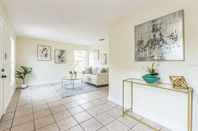 living room featuring light tile patterned floors and baseboards