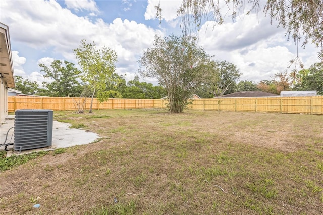 view of yard featuring central AC unit