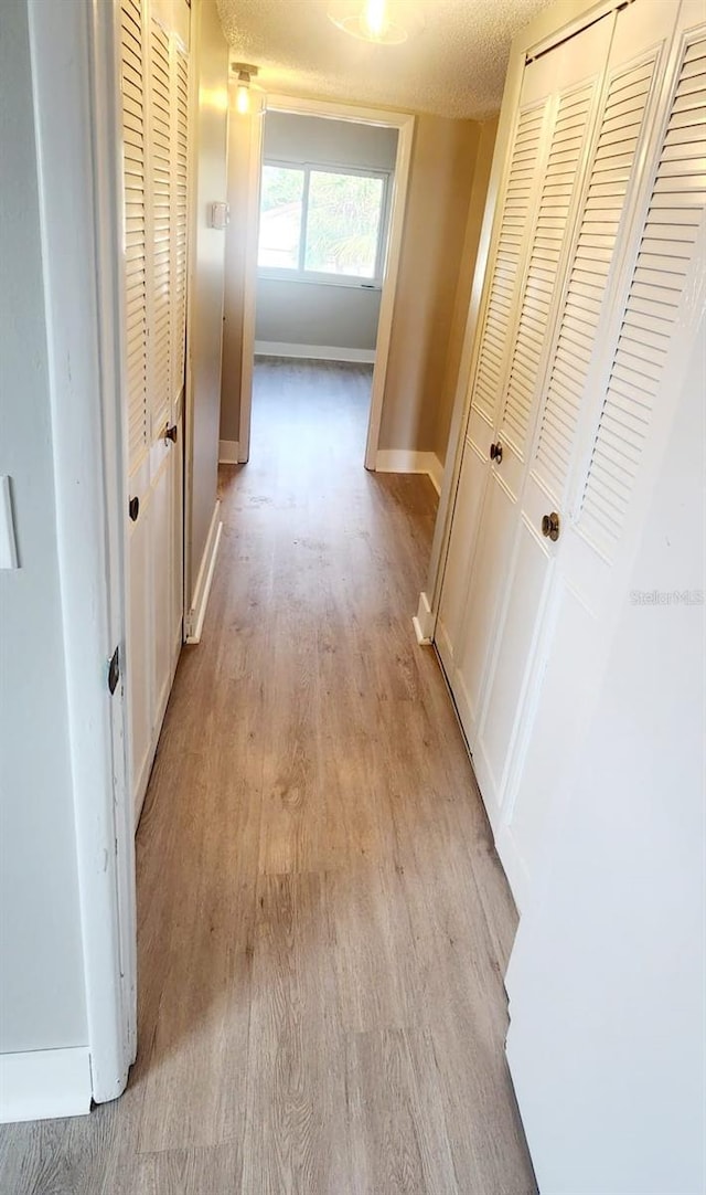 2205 Belleair Rd Unit A36, Clearwater, FL 33764 - hall featuring light wood finished floors and baseboards