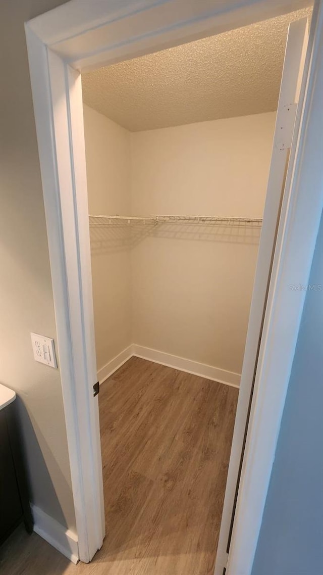 2205 Belleair Rd Unit A36, Clearwater, FL 33764 - walk in closet with wood finished floors