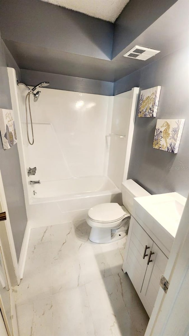 2205 Belleair Rd Unit A36, Clearwater, FL 33764 - full bathroom with marble finish floors, toilet, vanity, and shower / washtub combination