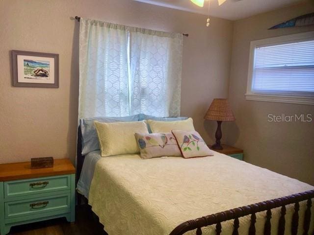 556 Virginia St, Dunedin, FL 34698 - bedroom with dark wood finished floors
