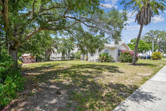 556 Virginia St, Dunedin, FL 34698 - view of green lawn with a shed and an outdoor structure