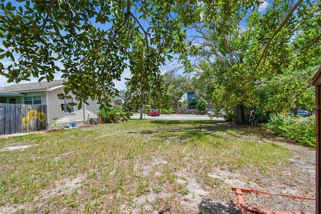 556 Virginia St, Dunedin, FL 34698 - view of yard featuring fence and central AC