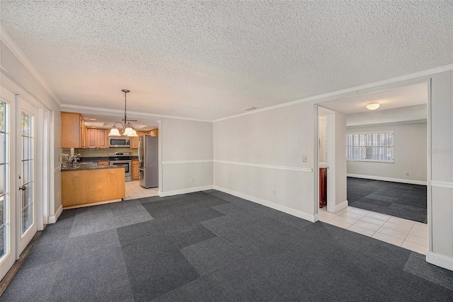 unfurnished living room featuring crown molding, light carpet, light tile patterned floors, baseboards, and a textured ceiling