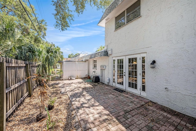 view of patio / terrace featuring a fenced backyard and french doors