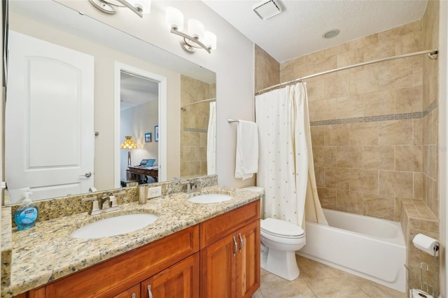 ensuite bathroom featuring tile patterned floors, shower / tub combo, double vanity, and toilet