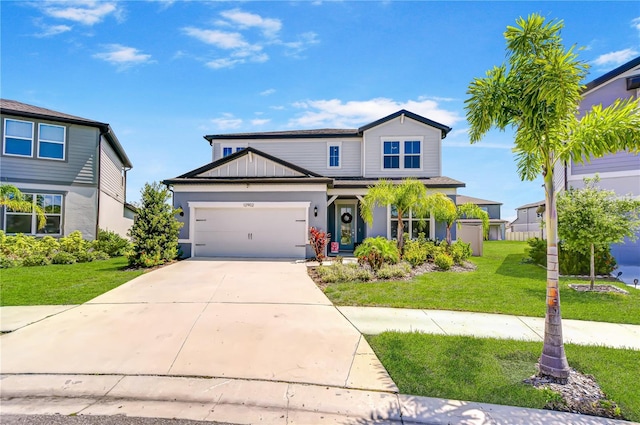 traditional-style home with a garage, a front yard, and driveway