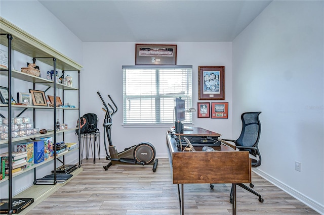office featuring wood finished floors and baseboards
