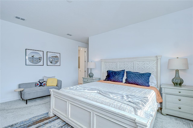 bedroom featuring light carpet and baseboards