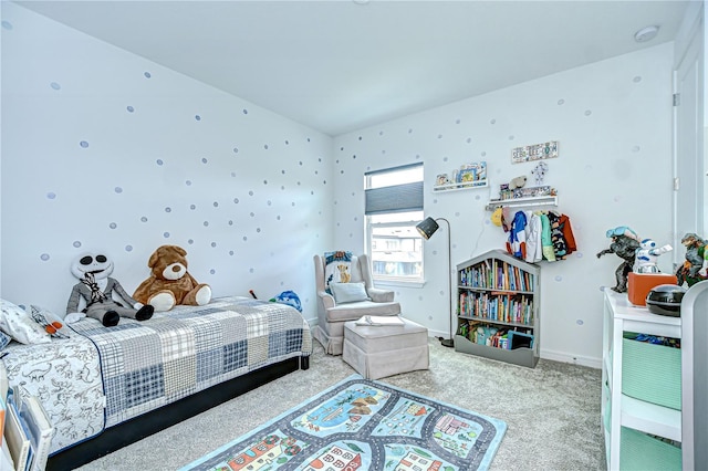 bedroom featuring carpet flooring and baseboards