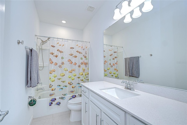 full bathroom featuring tile patterned floors, toilet, shower / bath combo with shower curtain, and vanity