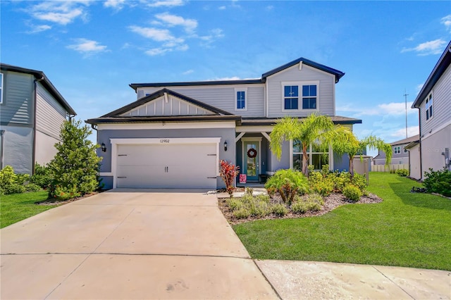 view of front of property with a front yard, driveway, and an attached garage