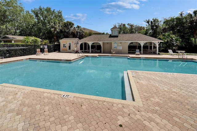 15855 Fishhawk View Dr, Lithia, FL 33547 - community pool with a patio and view of wooded area