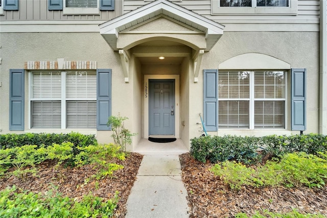 15855 Fishhawk View Dr, Lithia, FL 33547 - doorway to property featuring stucco siding