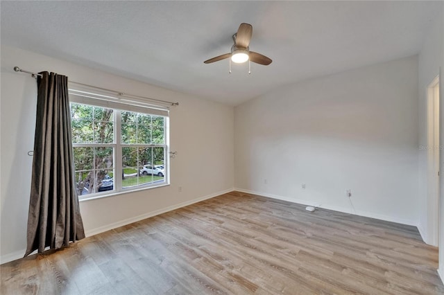 15855 Fishhawk View Dr, Lithia, FL 33547 - spare room with light wood finished floors, baseboards, and ceiling fan