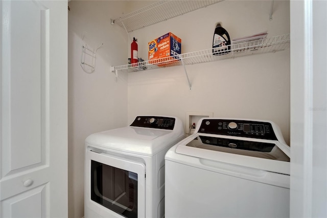 15855 Fishhawk View Dr, Lithia, FL 33547 - washroom with washing machine and clothes dryer