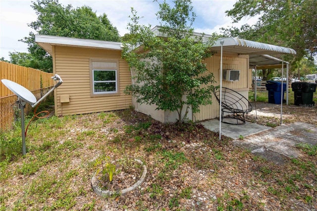 back of house featuring fence
