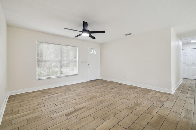 1801 E Navajo Ave, Tampa, FL 33612 - entrance foyer featuring a ceiling fan, light wood-style flooring, and baseboards