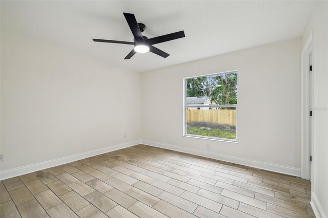 1801 E Navajo Ave, Tampa, FL 33612 - empty room with a ceiling fan and baseboards