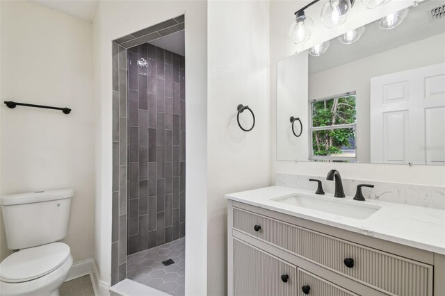 1801 E Navajo Ave, Tampa, FL 33612 - full bath with toilet, a tile shower, vanity, and tile patterned floors