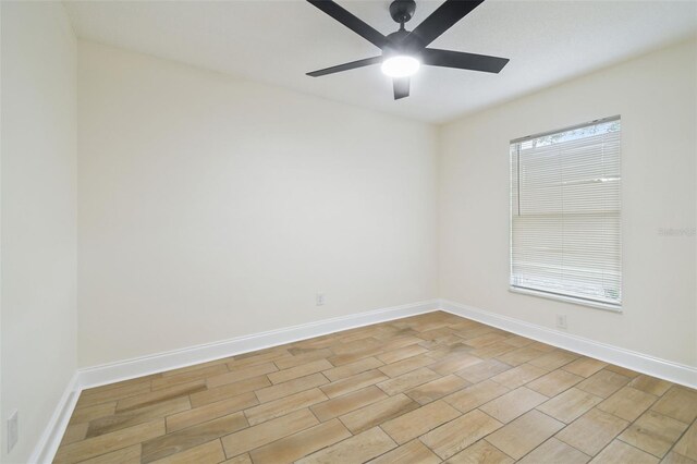1801 E Navajo Ave, Tampa, FL 33612 - spare room with a ceiling fan and baseboards