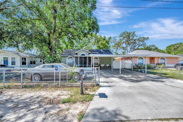 1505 E 99th Ave, Tampa, FL 33612 - single story home featuring a fenced front yard, concrete driveway, a gate, and stucco siding