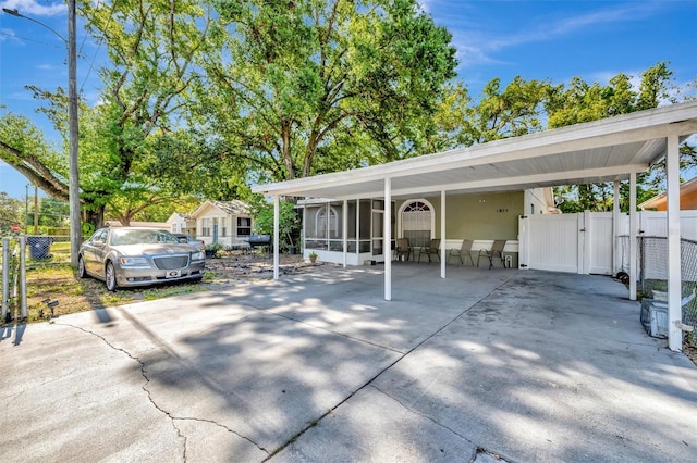 1505 E 99th Ave, Tampa, FL 33612 - view of parking featuring a gate and fence