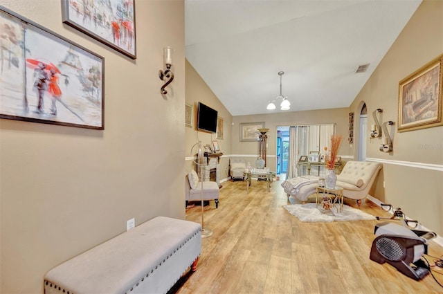 1505 E 99th Ave, Tampa, FL 33612 - hall with wood finished floors, a chandelier, lofted ceiling, arched walkways, and baseboards