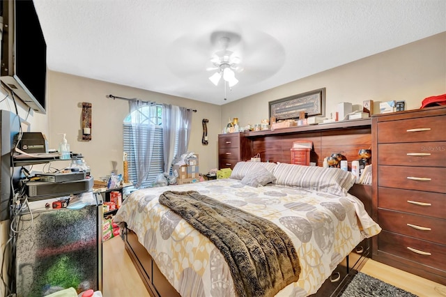 1505 E 99th Ave, Tampa, FL 33612 - bedroom with light wood finished floors and ceiling fan