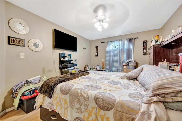 1505 E 99th Ave, Tampa, FL 33612 - bedroom with light wood-type flooring, baseboards, and a ceiling fan